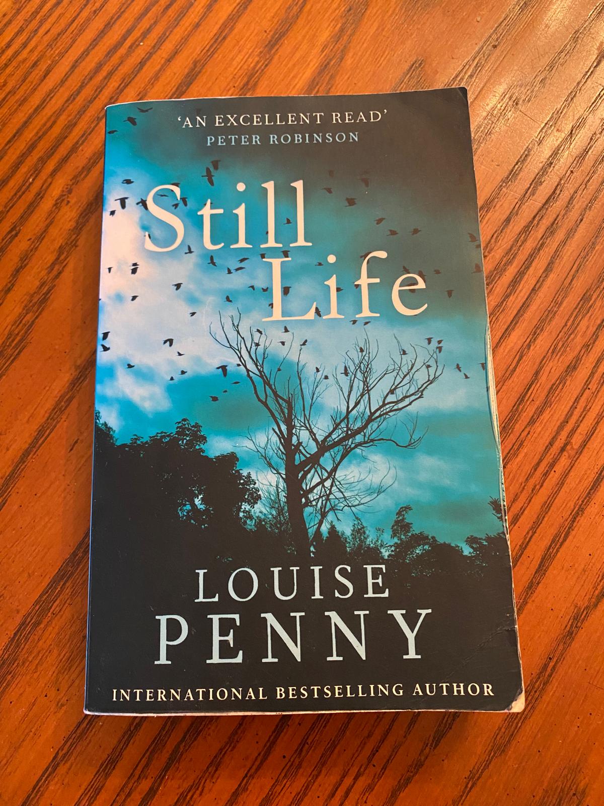 Paperback mystery novel on table