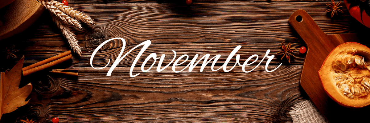 Pumpkin and fall cooking spices on a dark wooden background with the word November on it