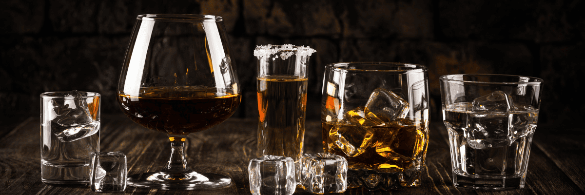 Photo of alcoholic drinks with a dark background and dark counter
