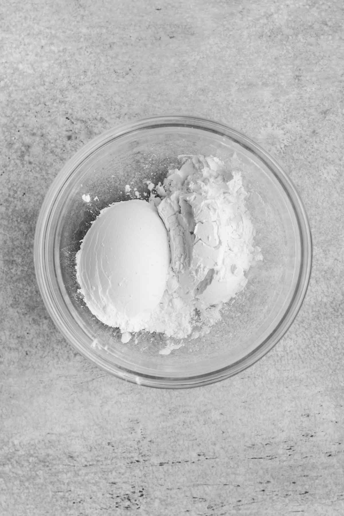 A glass bowl with the dry ingredients.