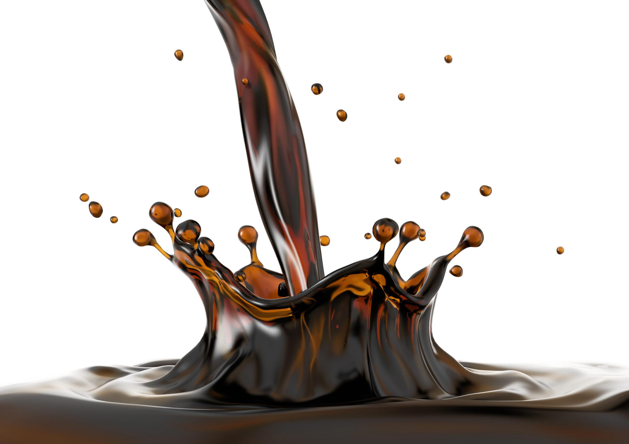 Liquid coffee pouring with crown splash in coffee pool with ripples.