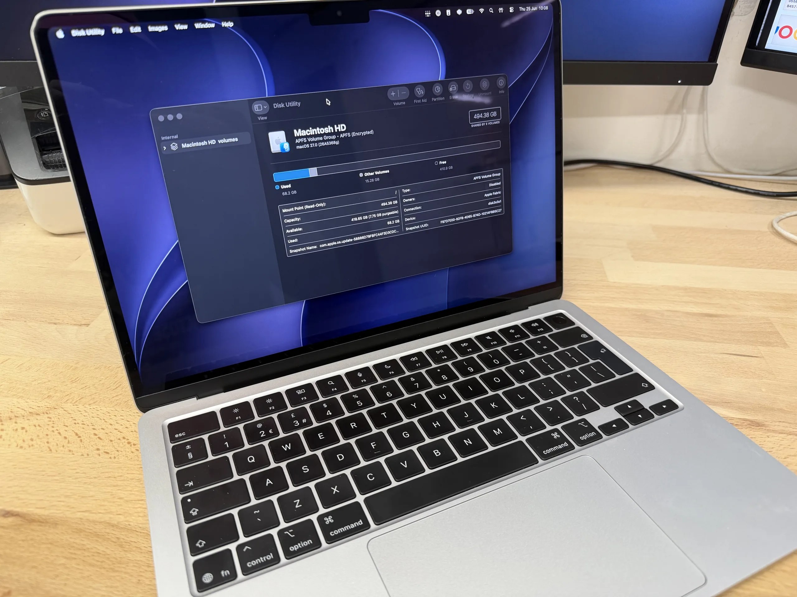 Silver MacBook Air with Disk Utility open