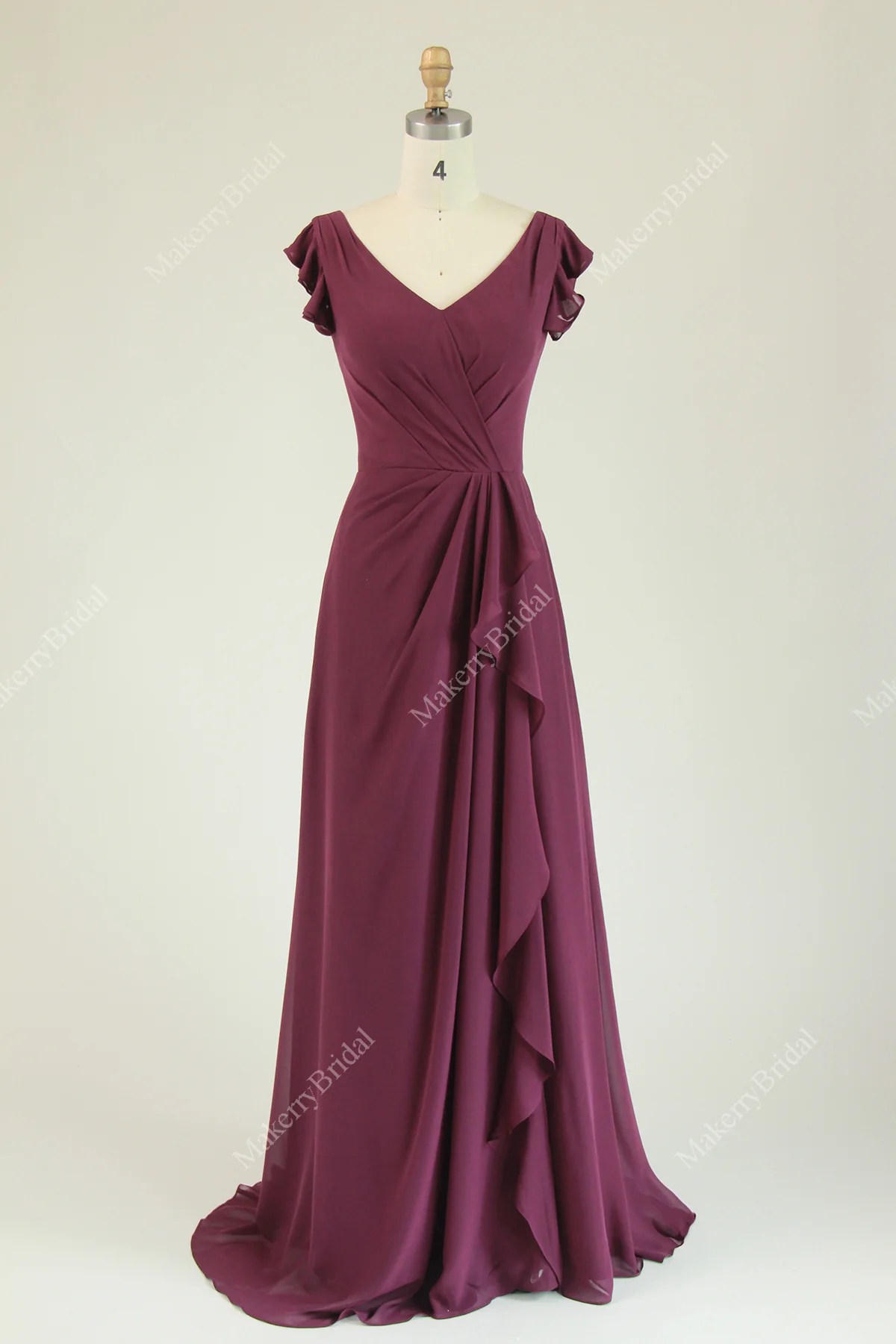 Chiffon bridesmaid dress featuring ruffled cap sleeves and cascading r