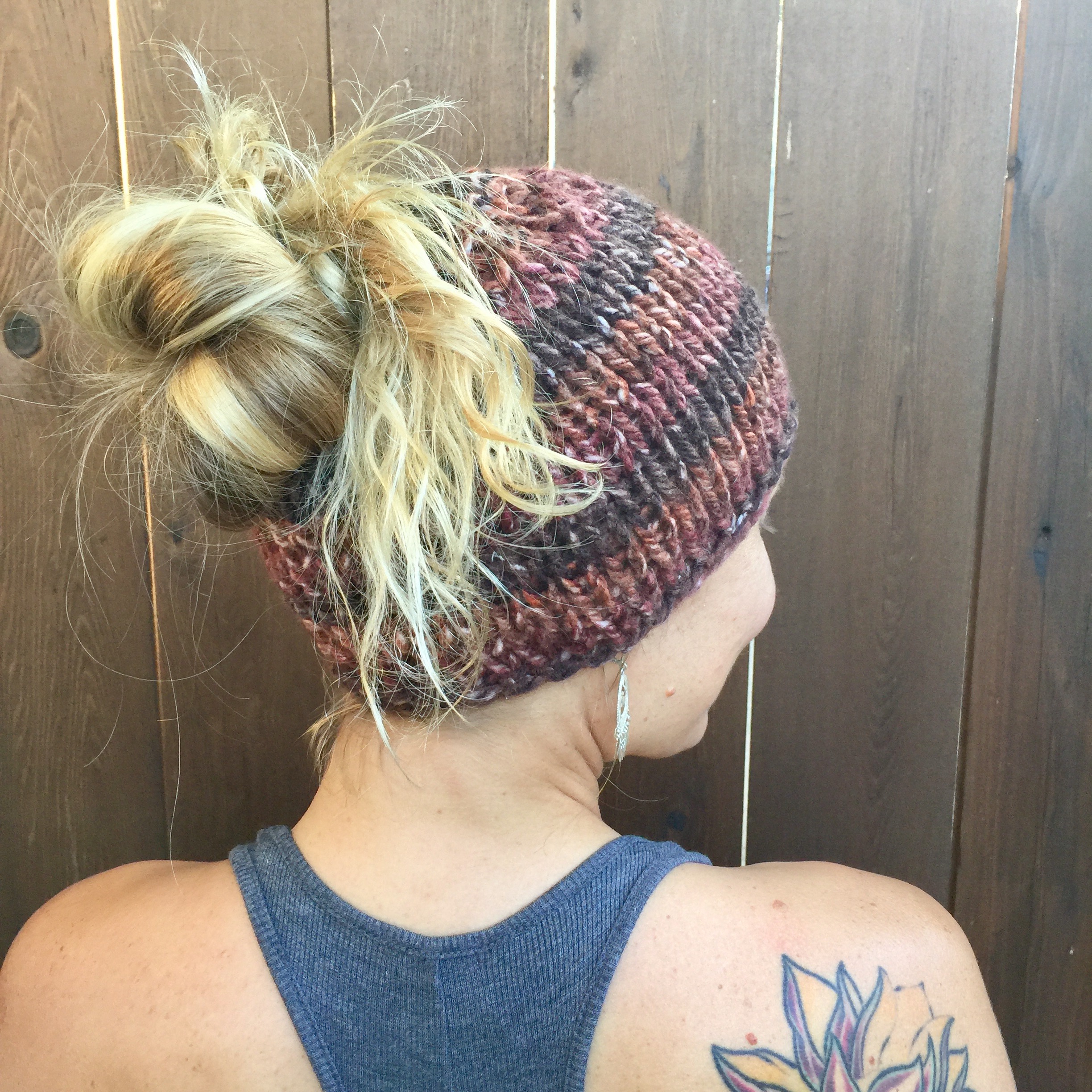 Knit hat with messy top bun hole