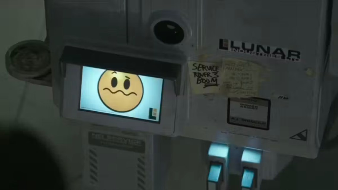 Console featuring a small screen with a yellow face whose mouth is contorted to indicate confusion.