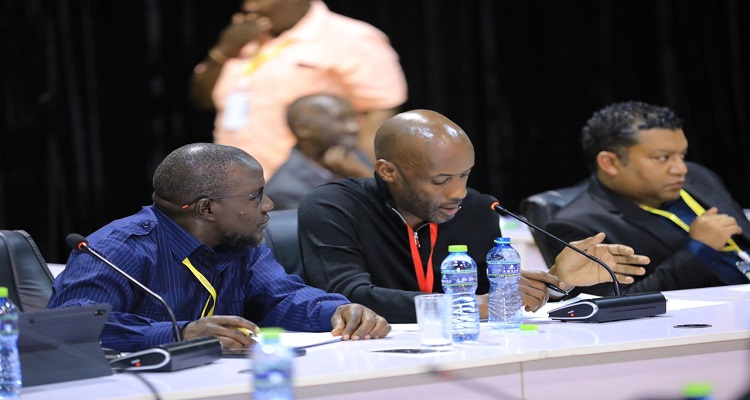 Hon. Enos Asiimwe (C) presents Uganda's bid at the CPA conference in Accra. On his right is Hon. Asuman Basalirwa.