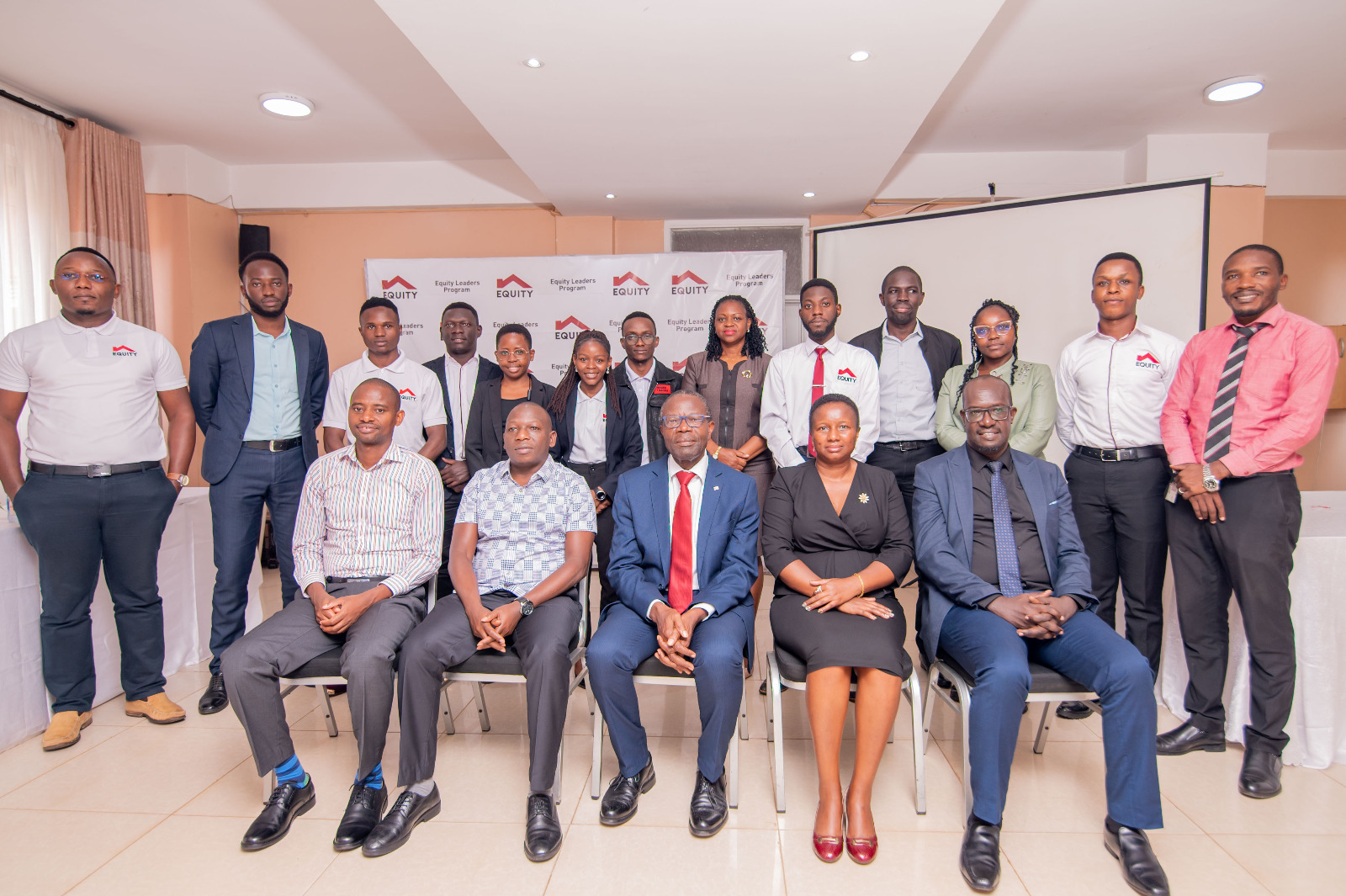L-R Julius Njuguna Co-Founder E&M Technology and Eliud Njogu, Sam Bwaya EGF Board Director, Elizabeth Wahito Equity Bank Education and Leadership Development and Nelson Mwebaze pose for a group photo with ELP Scholars.