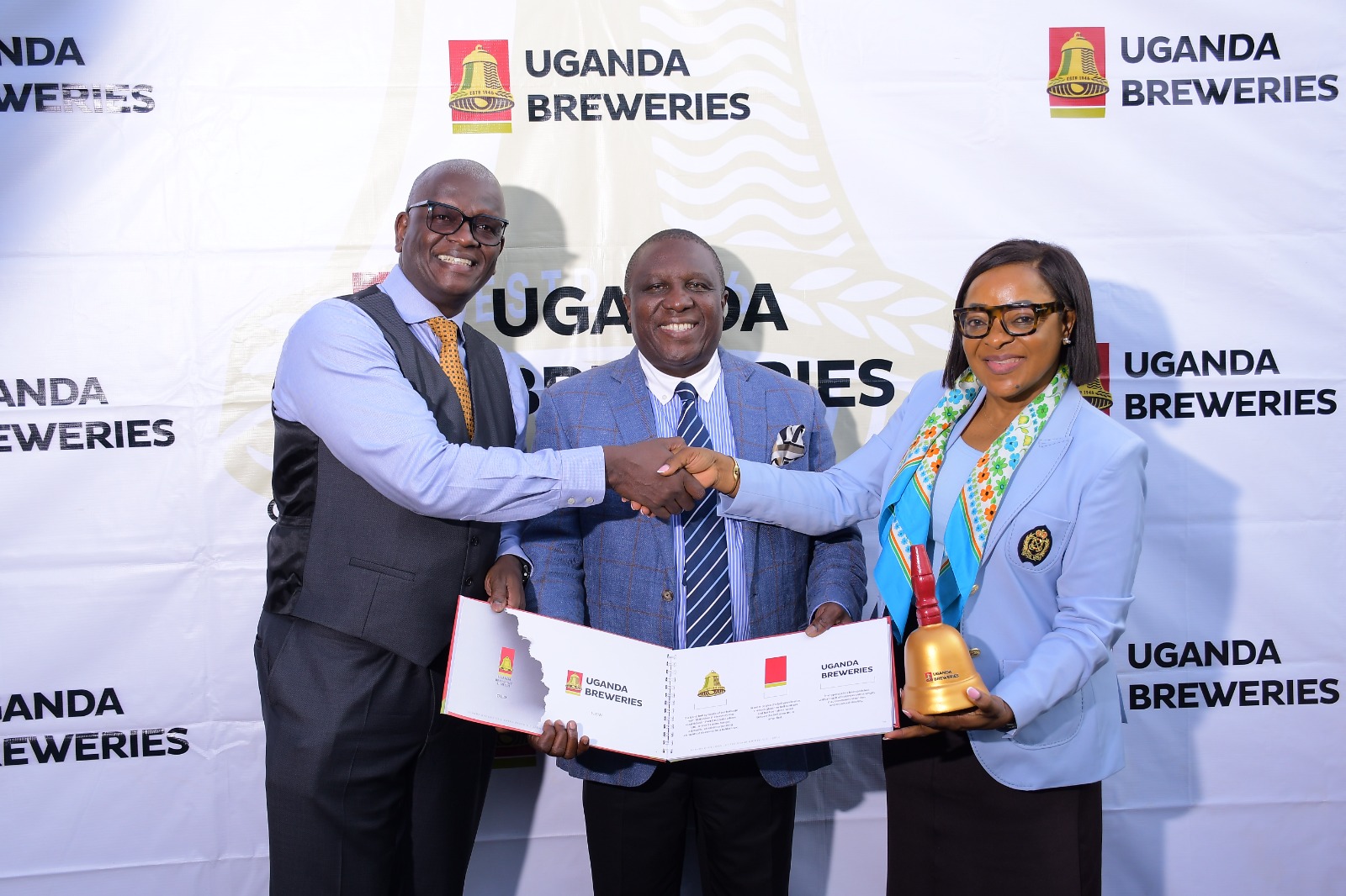 (L-R) Outgoing UBL MD Andrew Kilonzo, Jimmy D. Mugerwa, Chairman of the Board at Uganda Breweries Limited, and incoming UBL MD Felicite Nson.