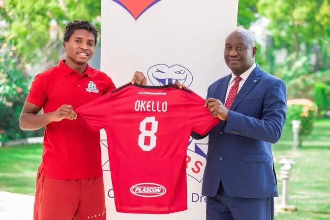 Allan Okello and VIpers SC President Dr Lawrence Mulindwa.