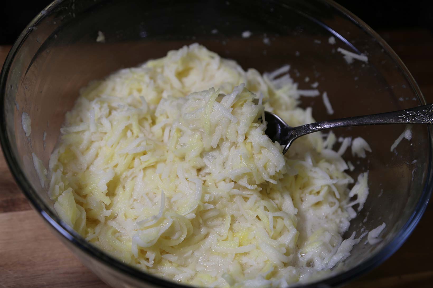 add starch to shredded potato mixture