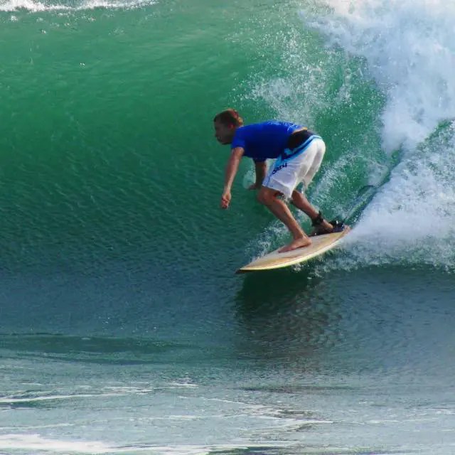 Bryan Blithe surfing a wave