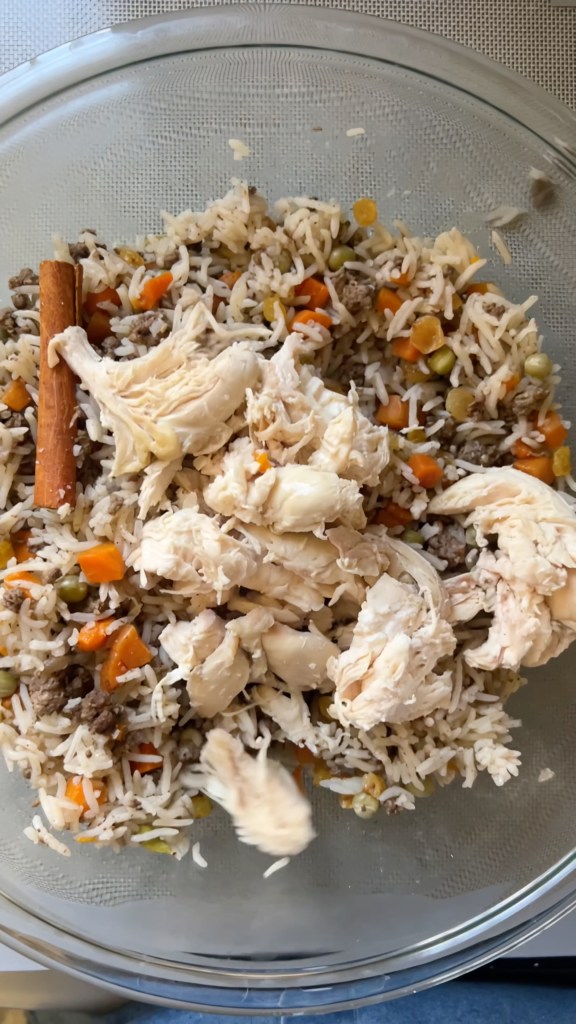 Golden raisins, cinnamon and cardamom added to Middle Eastern ouzi rice