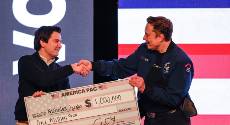 Elon handing over a check