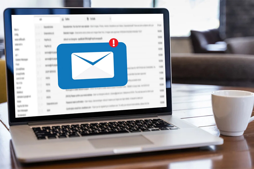 An Image showing a laptop with an email open, indicating receipt of the Memphis Reprographics Bid List