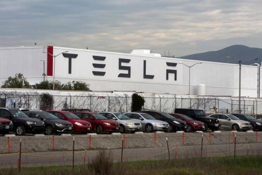 Tesla Workers Complain Of Long Hours Low Pay