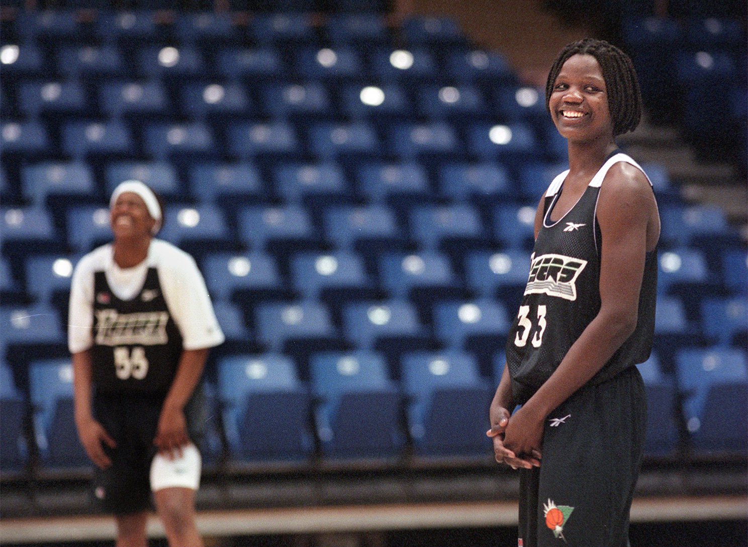 San Jose Lasers center Clarisse Machanguana jokes with teammate Sheri Sam (background) Wednesday during practice at the San Jose Event Center. (Jim Ketsdever/Bay Area News Group) 