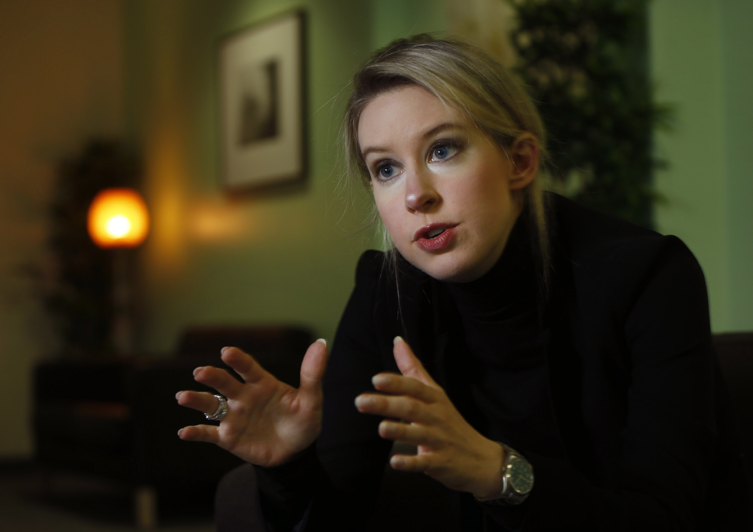 Elizabeth Holmes dropped out of Stanford in 2003 as a 19-year-old to start Theranos. She is photographed in 2014 while speaking about the company's vision at their headquarters in Palo Alto, Calif. Jurors found Holmes guilty on four of 11 charges on Monday, including one of two conspiracy charges and three of nine fraud charges. (Karl Mondon/Bay Area News Group)