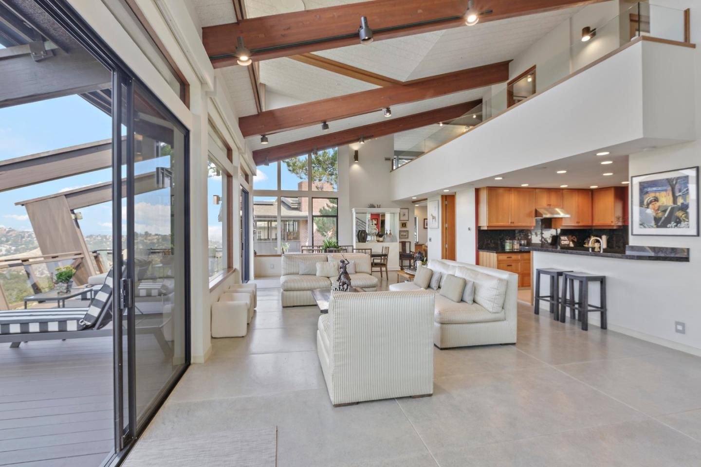 Open concept living room attached to deck.