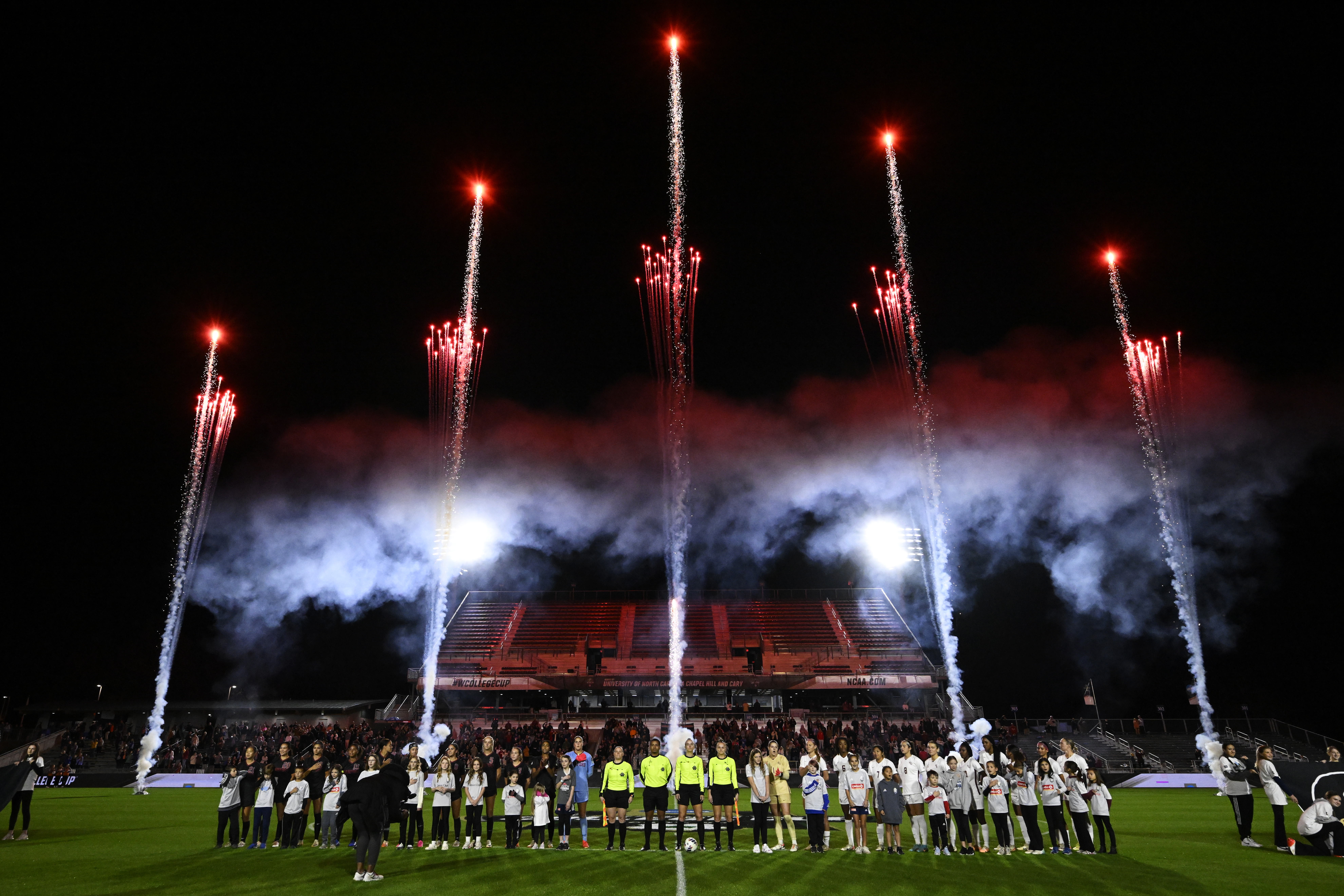 The Florida State Seminoles and Stanford Cardinal stand on the field during the National Anthem during the Division I Women's Soccer Championship at Wake Med Soccer Park on December 4, 2023 in Raleigh, North Carolina. (Photo by Eakin Howard/Getty Images)