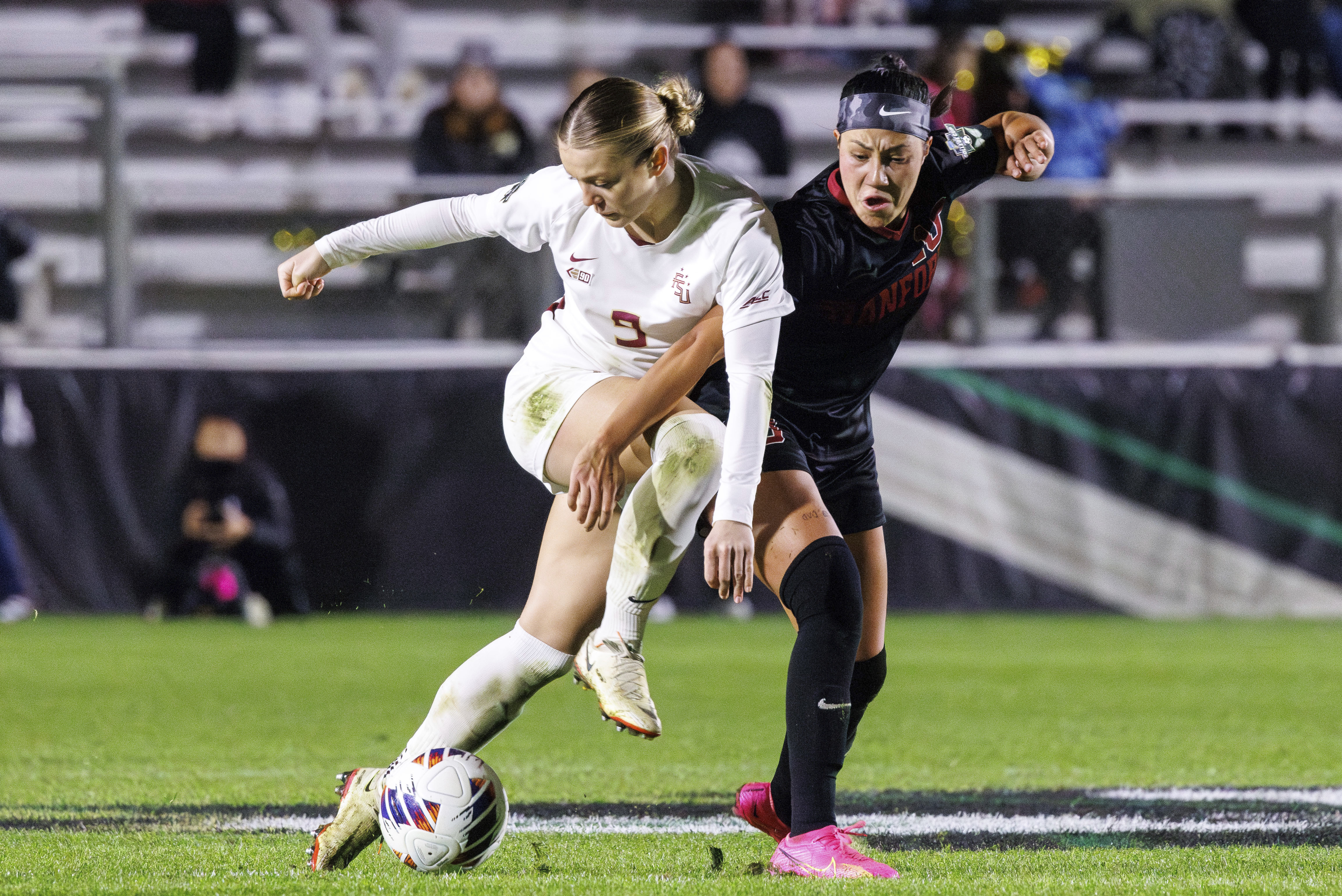 Florida State'sBeata Olsson (9) and Stanford's Maya Doms, right, fight for the ball during the second half of the NCAA college women's soccer tournament final in Cary, N.C., Monday, Dec. 4, 2023. (AP Photo/Ben McKeown)