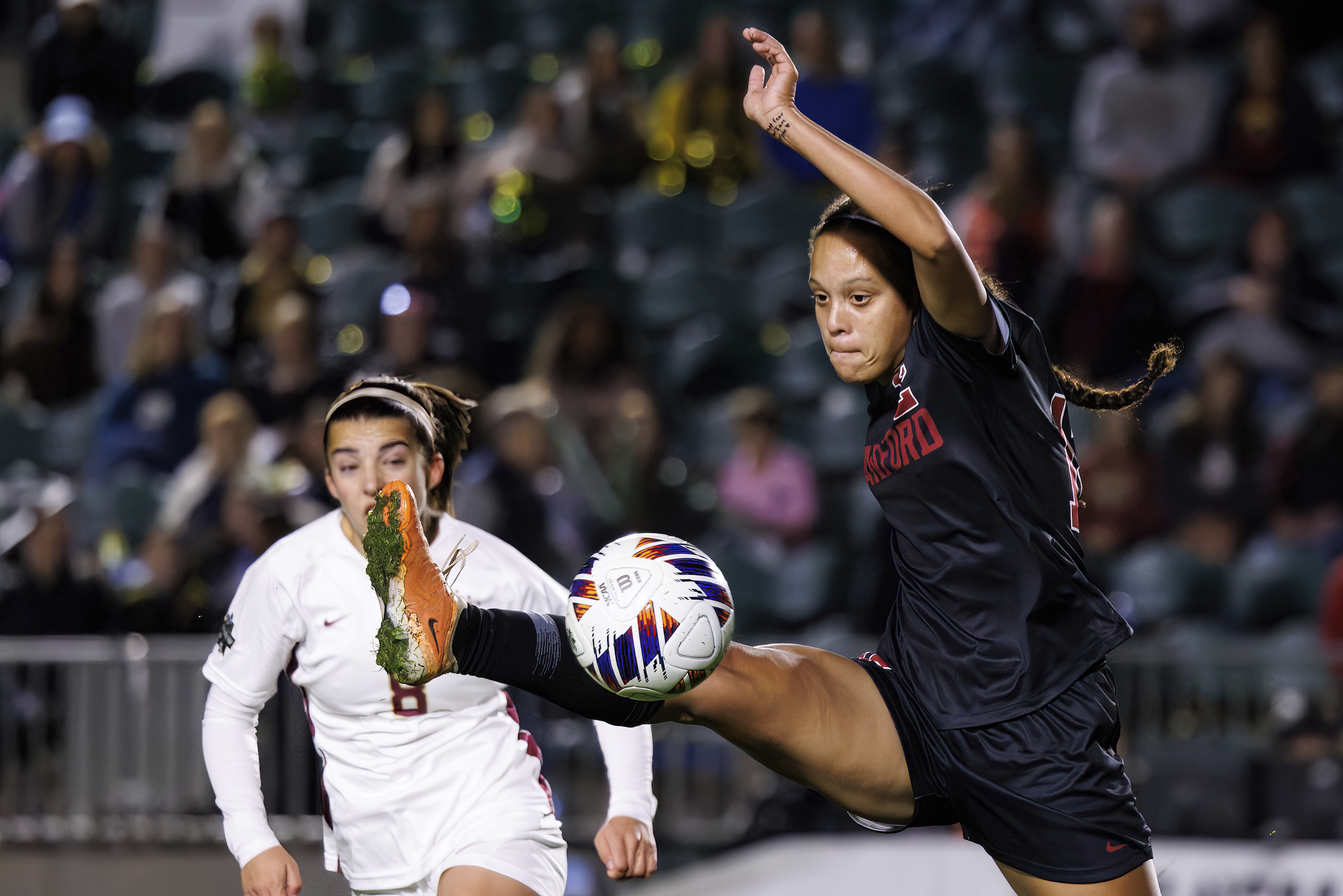 Stanford's Jasmine Aikey, right, reaches for the ball ahead of Florida State's Lauren Flynn (8) during the first half of the NCAA college women's soccer tournament final in Cary, N.C., Monday, Dec. 4, 2023. (AP Photo/Ben McKeown)