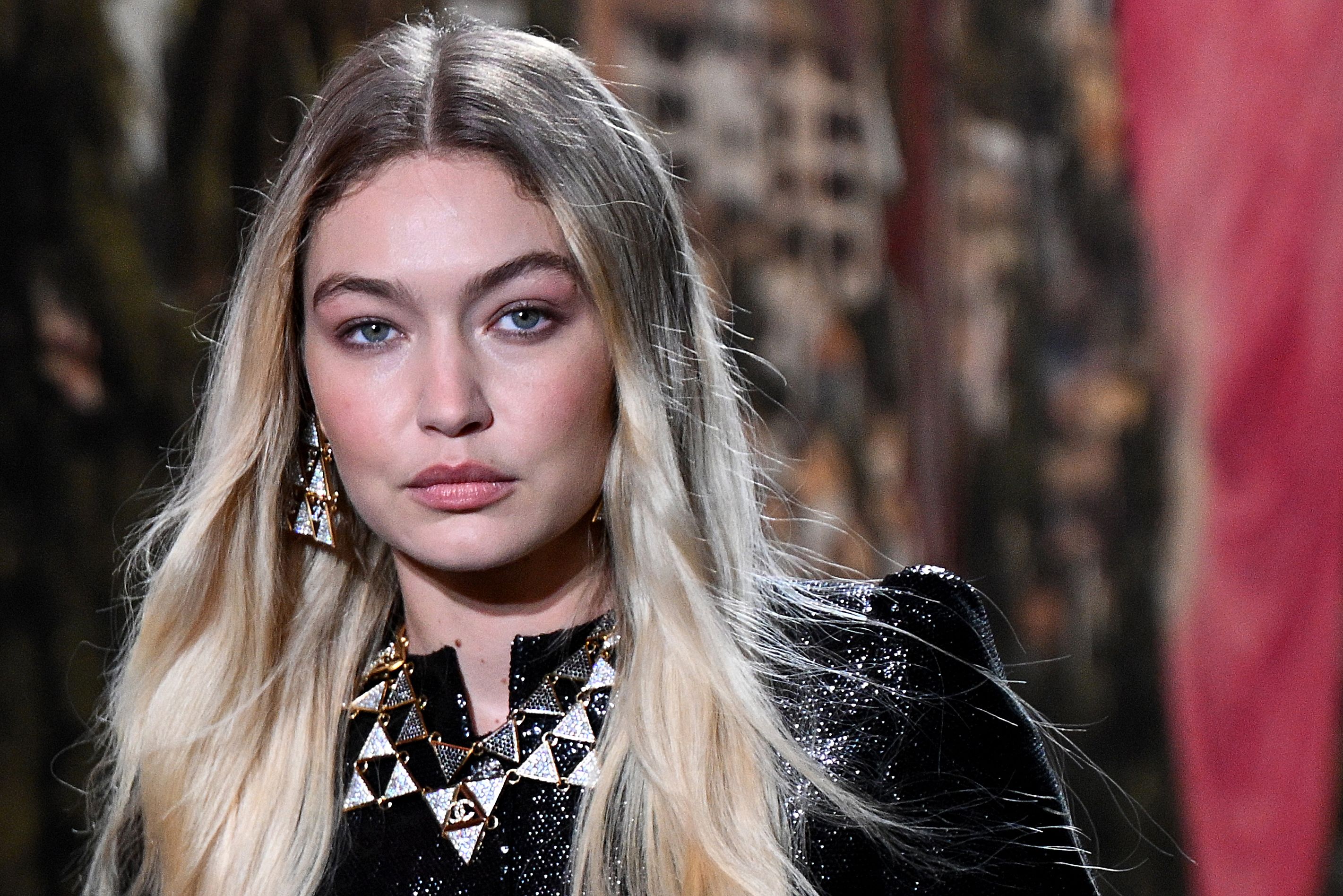 US Model Gigi Hadid walks the runway to present a creation by Chanel during the Paris Fashion Week Womenswear Spring/Summer 2024 at the Grand Palais Ephemere in Paris on October 3, 2023. (Photo by Bertrand GUAY / AFP) (Photo by BERTRAND GUAY/AFP via Getty Images)