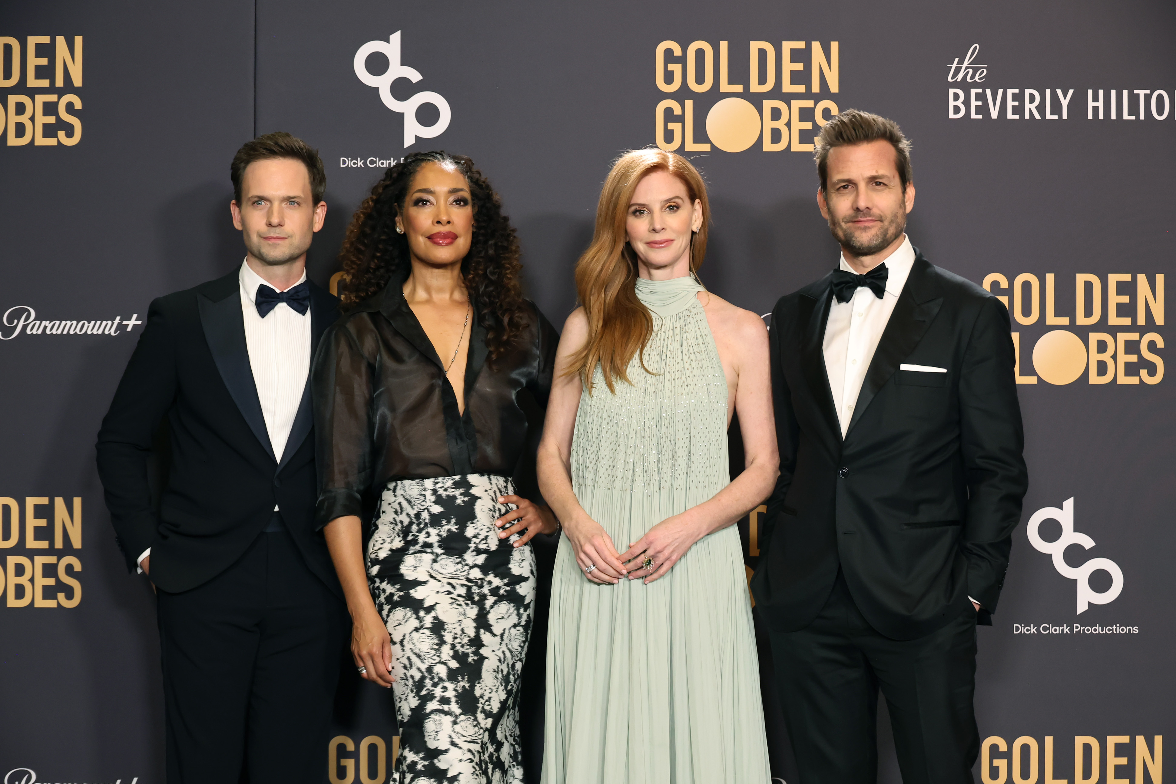 BEVERLY HILLS, CALIFORNIA - JANUARY 07: (L-R) Patrick J. Adams, Gina Torres, Sarah Rafferty, and Gabriel Macht pose in the press room during the 81st Annual Golden Globe Awards at The Beverly Hilton on January 07, 2024 in Beverly Hills, California. (Photo by Amy Sussman/Getty Images)