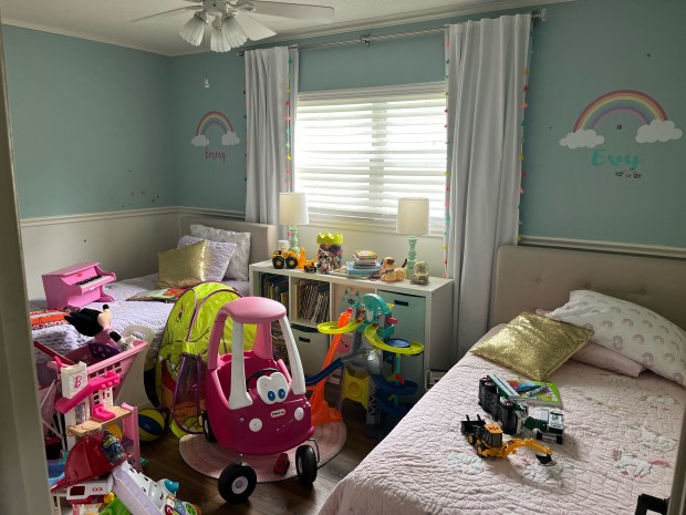 BEFORE: Toys and kid clutter had taken over a guest room at Maureen Rabazinski's house and her home office was filled with baby gear, including a crib. (Courtesy Maureen Rabazinski)