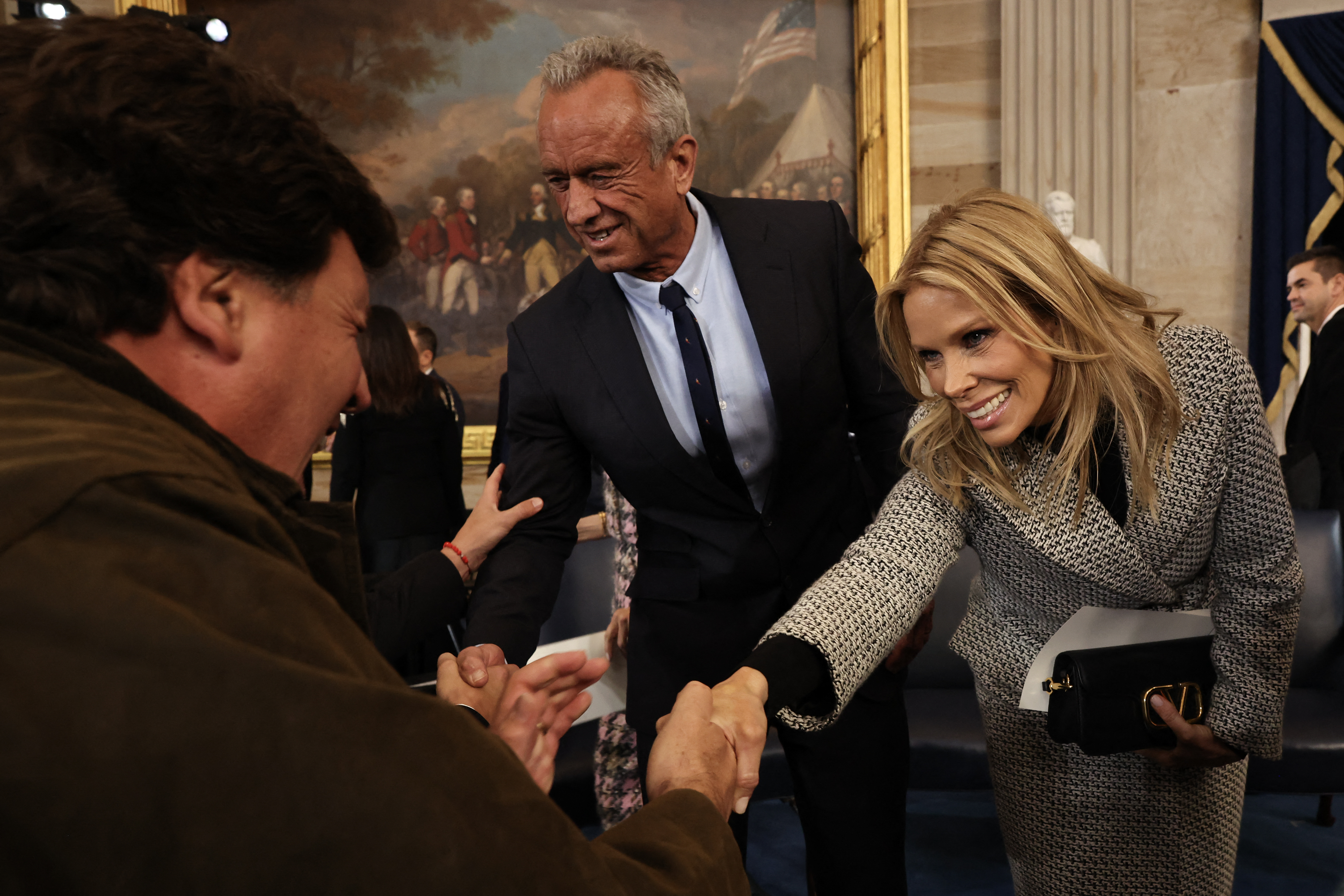 (L-R) US Secretary of Health and Human Services nominee Robert F. Kennedy Jr. and his wife Cheryl Hines depart at the conclusion of the inauguration ceremony where President Donald Trump was sworn in as the 47th US President in the US Capitol Rotunda in Washington, DC, on January 20, 2025. (Photo by Chip Somodevilla / POOL / AFP) (Photo by CHIP SOMODEVILLA/POOL/AFP via Getty Images)
