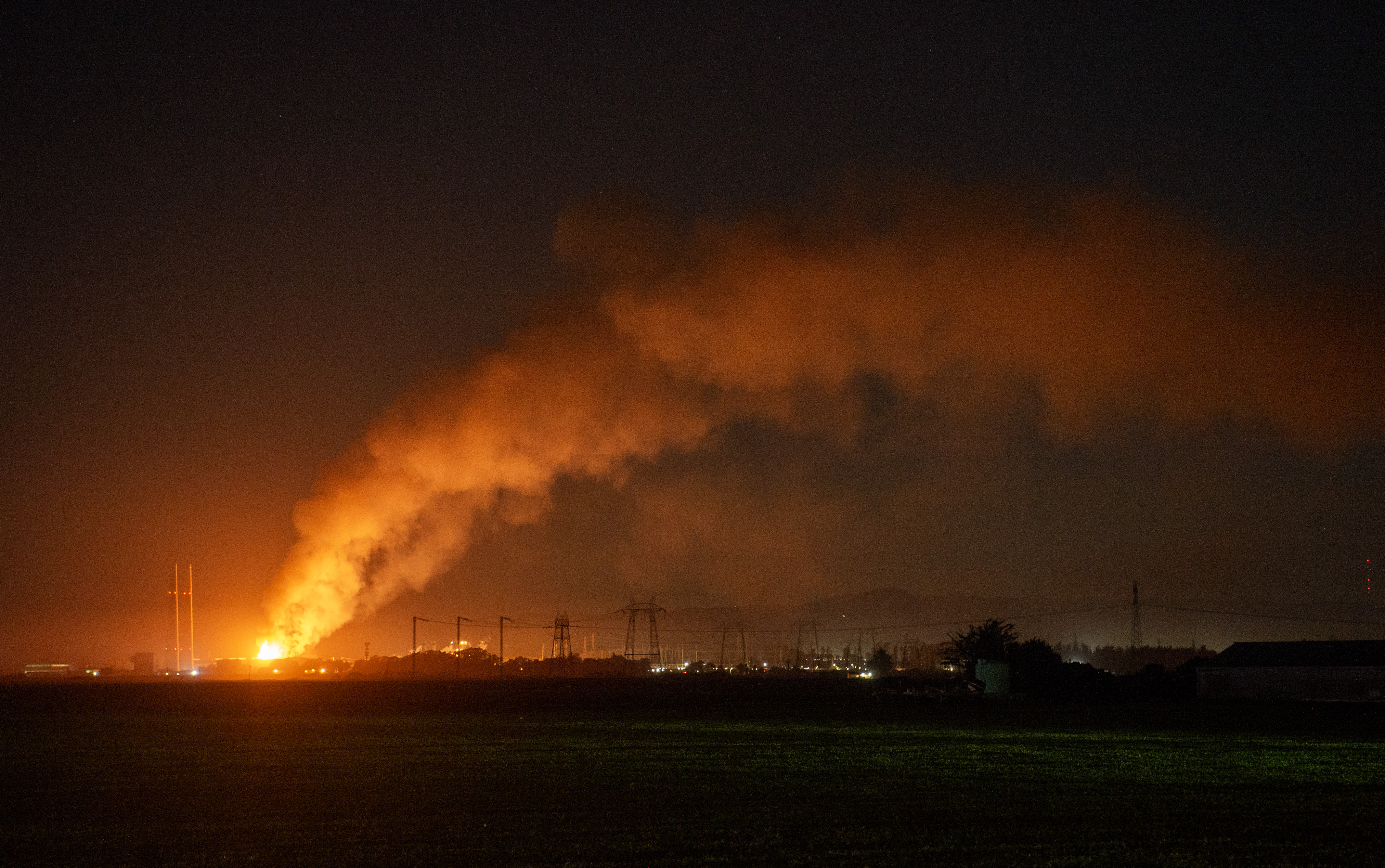 Smoke and flames are seen from Castroville as a fire at the Vistra battery storage plant burns in Moss Landing, Calif., on Thursday, Jan. 16, 2025. (Doug Duran/Bay Area News Group)