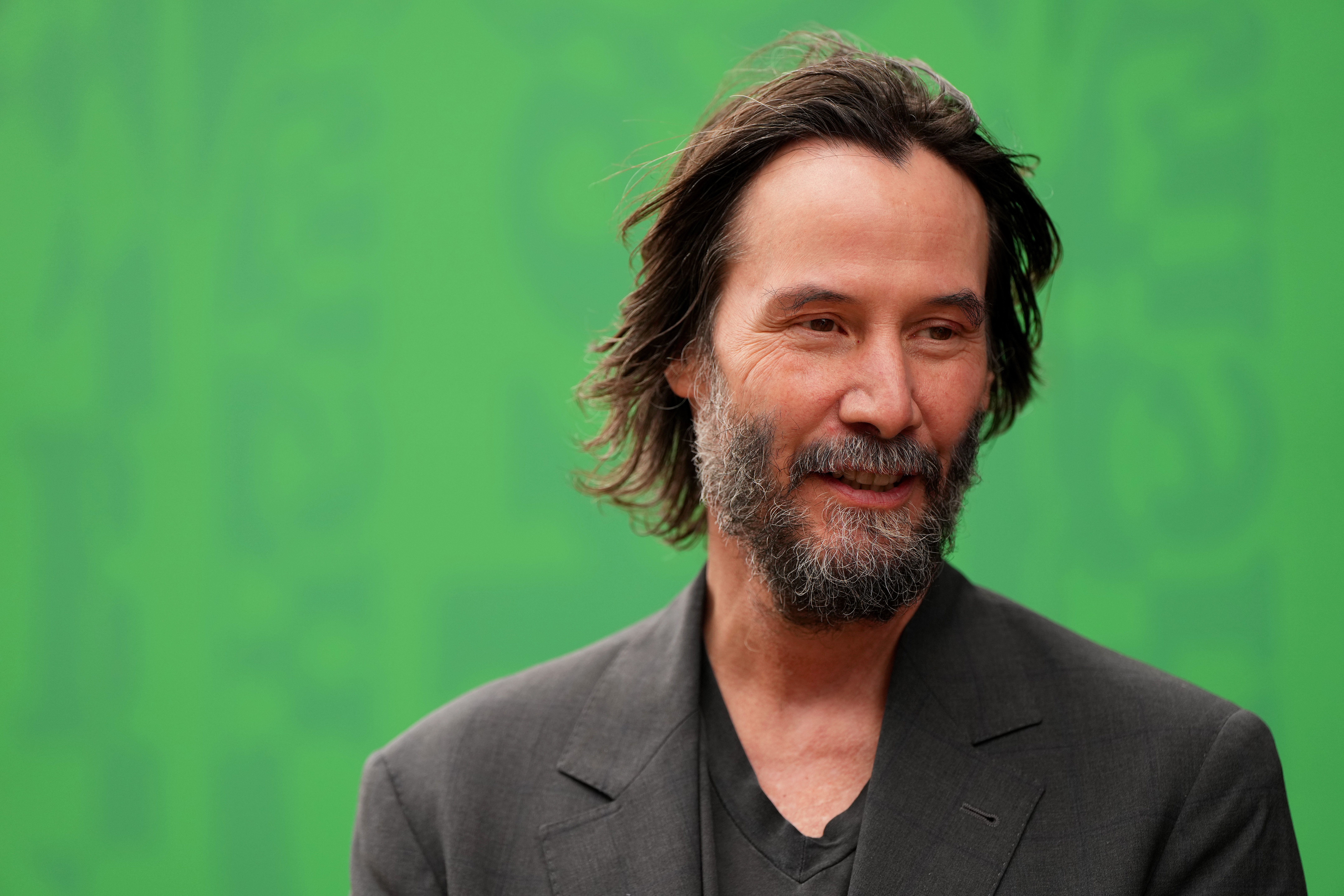 NORTHAMPTON, ENGLAND - JULY 05: Actor Keanu Reeves looks on in the paddock before qualifying ahead of the F1 Grand Prix of Great Britain at Silverstone Circuit on July 05, 2025 in Northampton, England. (Photo by Alex Bierens de Haan/Getty Images)