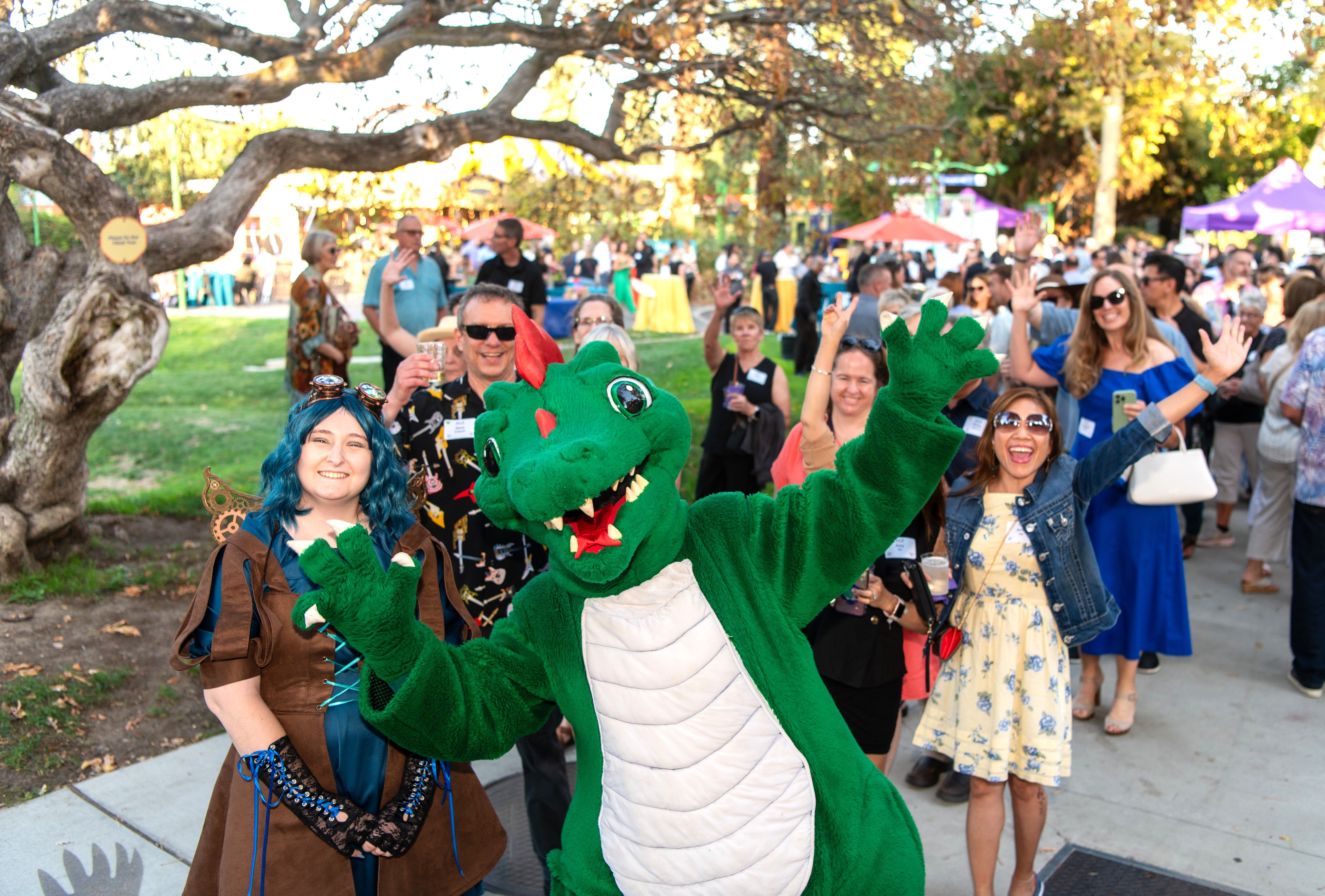 Danny the Dragon clowns around with guests at the third annual "Hooray for Happy Hollow," a fundraiser for Happy Hollow Foundation held at the San Jose park and zoo on Saturday, Sept. 20, 2025. (Photo courtesy Happy Hollow Foundation)