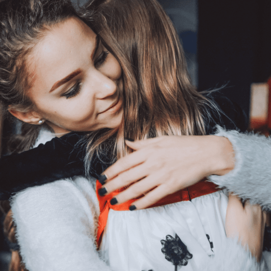 Parenting with Migraines: Mom hugging daughter