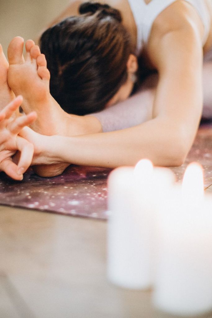 Exercise tips and migraines: woman doing yoga