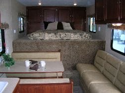 24+ Awesome Travel Trailers With Bedroom Slide Out / 5th Wheel Toy Hauler: Guide to RV Adventure, Garage Included : The main feature of this travel trailer model is that it comes with two entryways which are very helpful to keep the privacy intact.