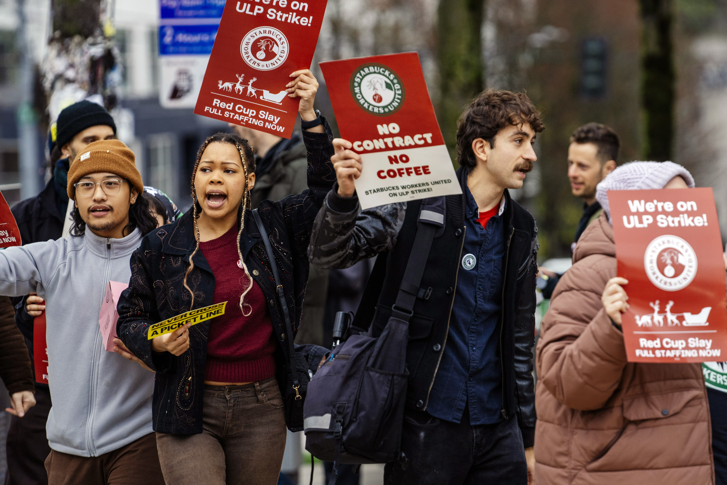 SEATTLE, WASHINGTON - DEC 20, 2024. Starbucks employees picket outside the Starbucks Reserve Roastery and Tasting Room as part of nationwide strikes at Starbucks locations, in Seattle, Washington, USA, on Fri., Dec. 20, 2024. The Roastery is one of five unionized Seattle locations on strike today, the first of a five day strike by Starbucks employees. Workers from the five Seattle locations gathered together this afternoon outside the Roastery after closing down the stores where they work. CREDIT: M. Scott Brauer for the New York Times