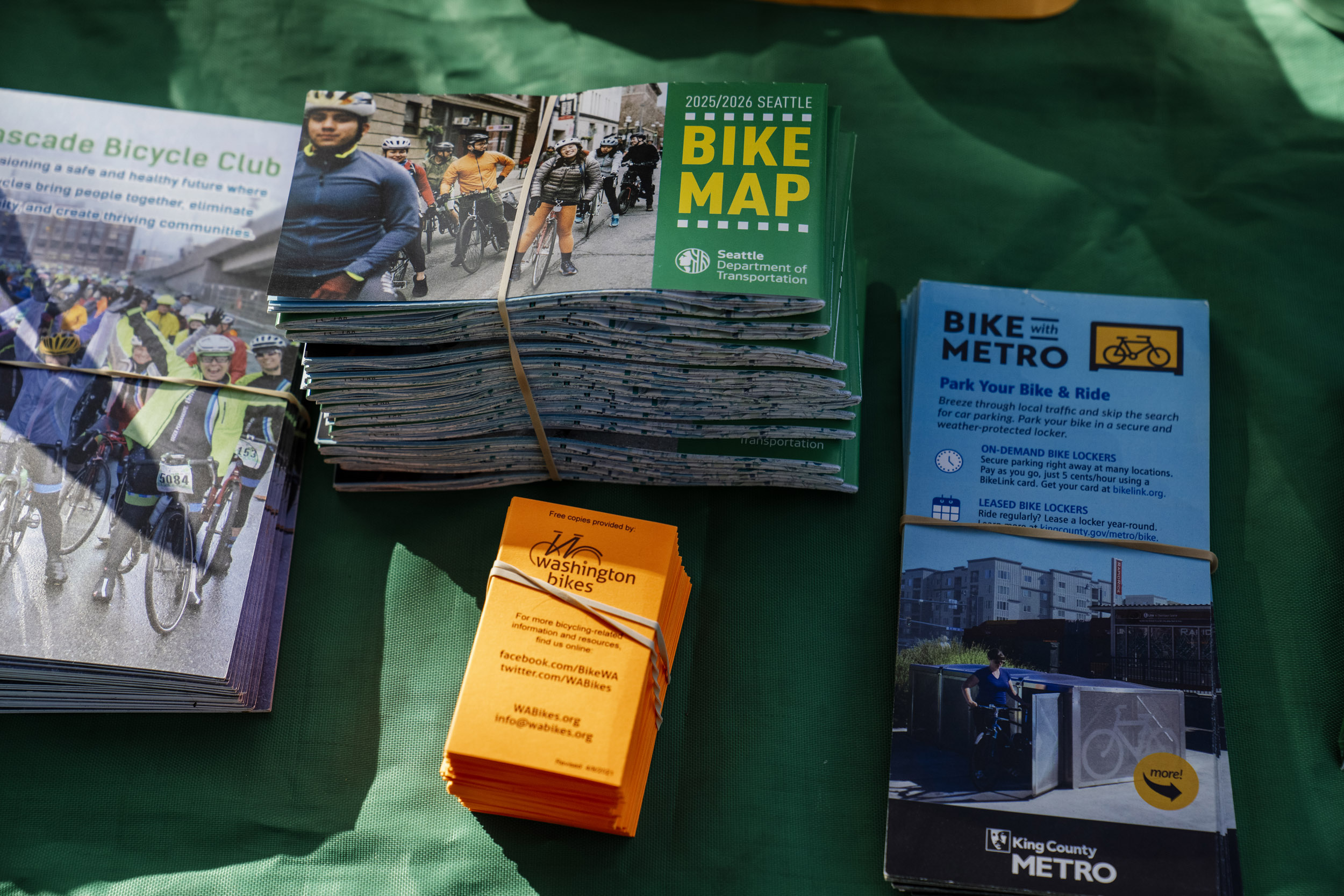 Bike safety information and maps are available for  Pedal Forward Shoreline participants before they take part in an e-bike-focused urban cycling class put on by Cascade Bicycle Club at Ridgecrest Elementary School in Shoreline, Washington, USA, on Wed., May 7, 2025. Pedal Forward Shoreline is a program to give free e-bikes to residents in what has been deemed an “overburdened community” determined to have health, social, and environmental inequities at the south end of Shoreline east of I-5. As part of an effort to reduce driving in the city, the program will give out approximately 100 e-bikes to residents in the neighborhood, prioritizing households with incomes at or below 80% of the King County median income.   (M. Scott Brauer / Cascade PBS)