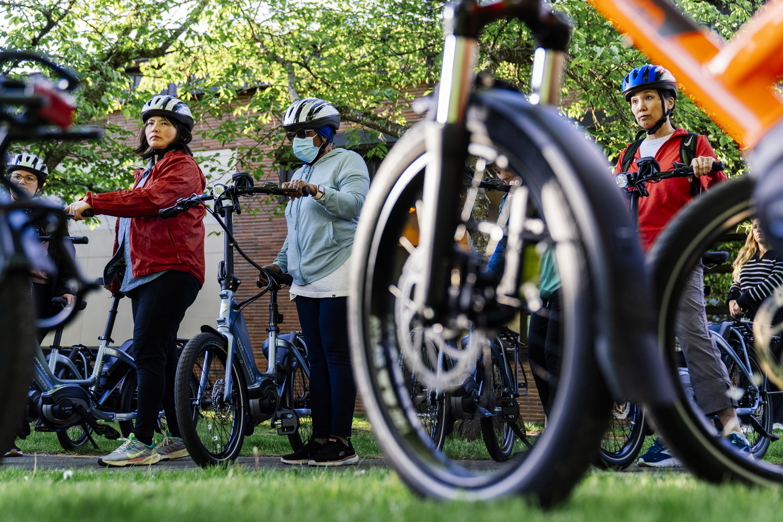 Pedal Forward Shoreline participants take part in an e-bike-focused urban cycling class put on by Cascade Bicycle Club at Ridgecrest Elementary School in Shoreline, Washington, USA, on Wed., May 7, 2025. Pedal Forward Shoreline is a program to give free e-bikes to residents in what has been deemed an “overburdened community” determined to have health, social, and environmental inequities at the south end of Shoreline east of I-5. As part of an effort to reduce driving in the city, the program will give out approximately 100 e-bikes to residents in the neighborhood, prioritizing households with incomes at or below 80% of the King County median income.   (M. Scott Brauer / Cascade PBS)