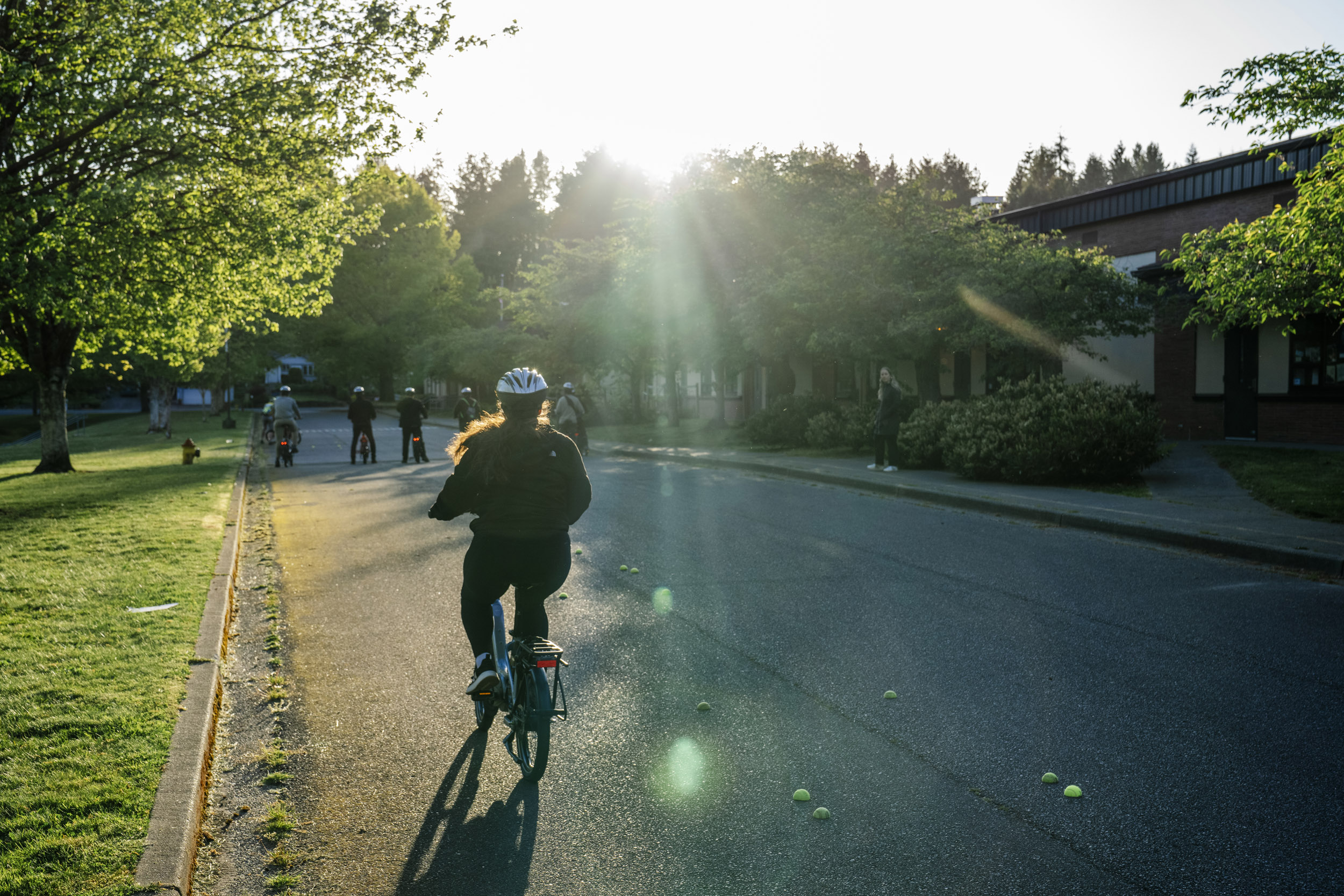 Pedal Forward Shoreline participants take part in an e-bike-focused urban cycling class put on by Cascade Bicycle Club at Ridgecrest Elementary School in Shoreline, Washington, USA, on Wed., May 7, 2025. Pedal Forward Shoreline is a program to give free e-bikes to residents in what has been deemed an “overburdened community” determined to have health, social, and environmental inequities at the south end of Shoreline east of I-5. As part of an effort to reduce driving in the city, the program will give out approximately 100 e-bikes to residents in the neighborhood, prioritizing households with incomes at or below 80% of the King County median income.   (M. Scott Brauer / Cascade PBS)