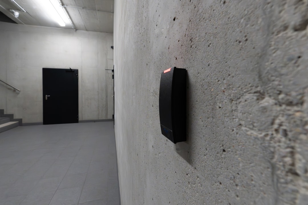 Electronic access control card reader beside a secure door