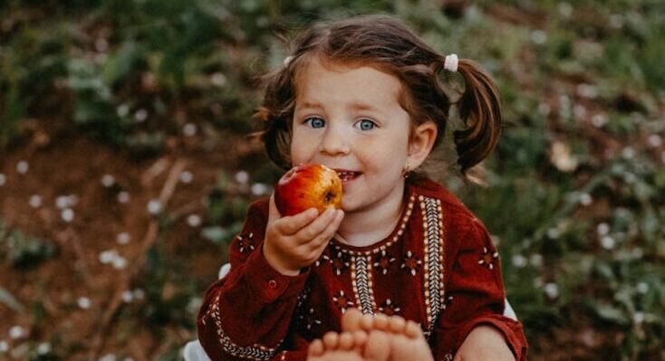 Girl eating apple