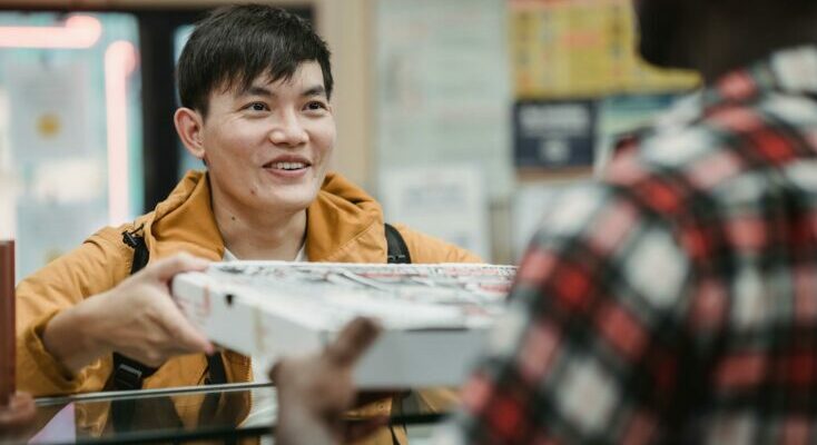 Man buying pizza