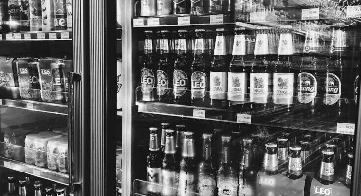 Beer bottles on shelves in store