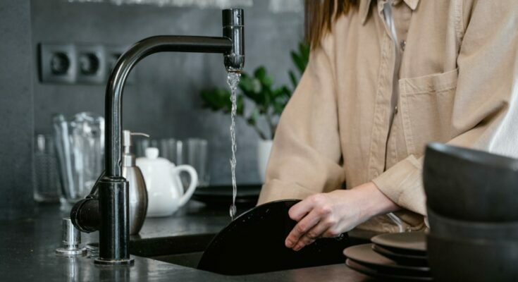 a person washing dishes
