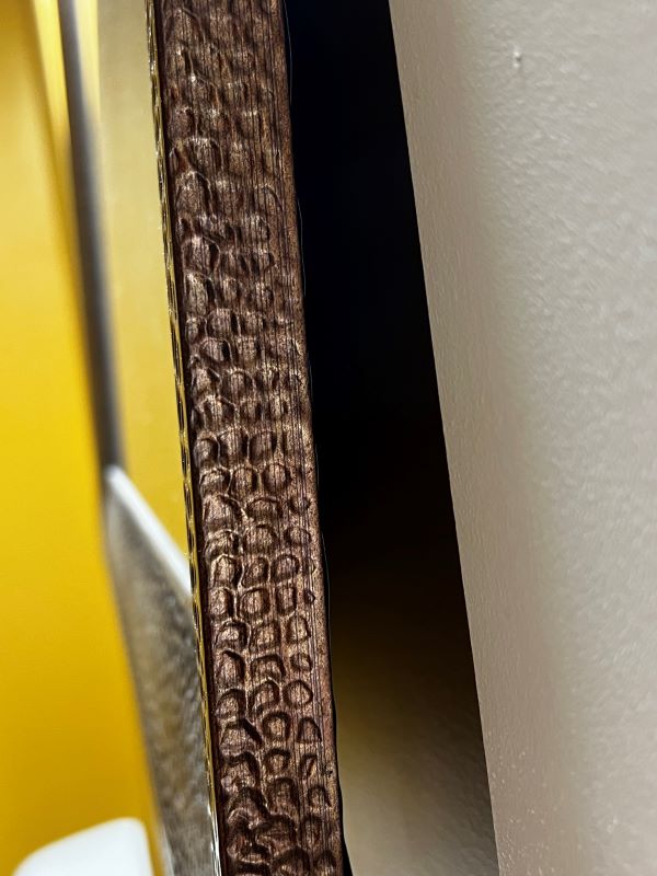 Brown Recluse will hide behind items hanging on the wall