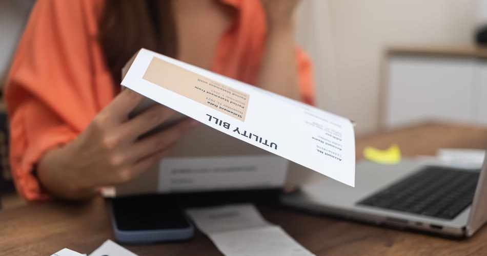 Woman examining bill