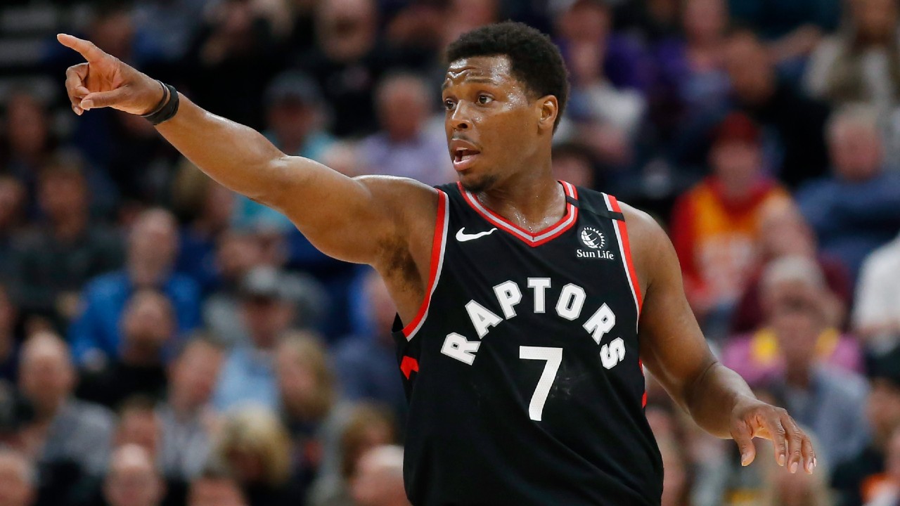 Toronto Raptors guard Kyle Lowry (7) directs his team in the first half during an NBA basketball game against the Utah Jazz