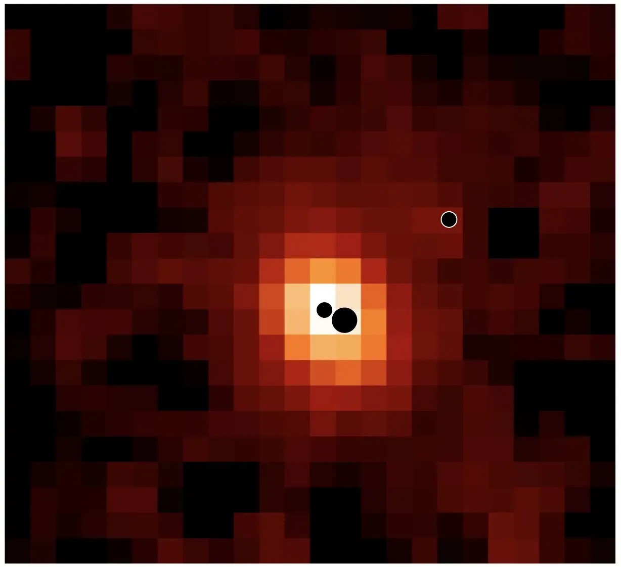 A map of the galaxy J0148-4214 with dots showing the locations of the three supermassive black holes
