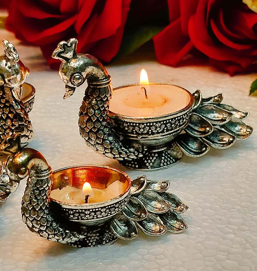 German silver antique exclusive peacock diya 🪔 pair 🕉️With pure silver looks fine carved finish 🕉️Available in 2 size