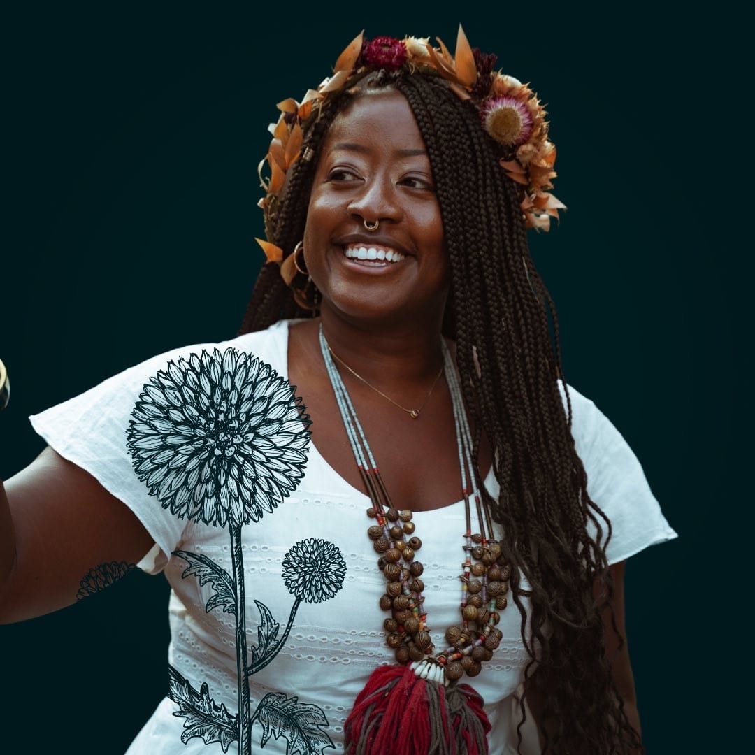 Asia Dorsey wearing a crown of dried flowers